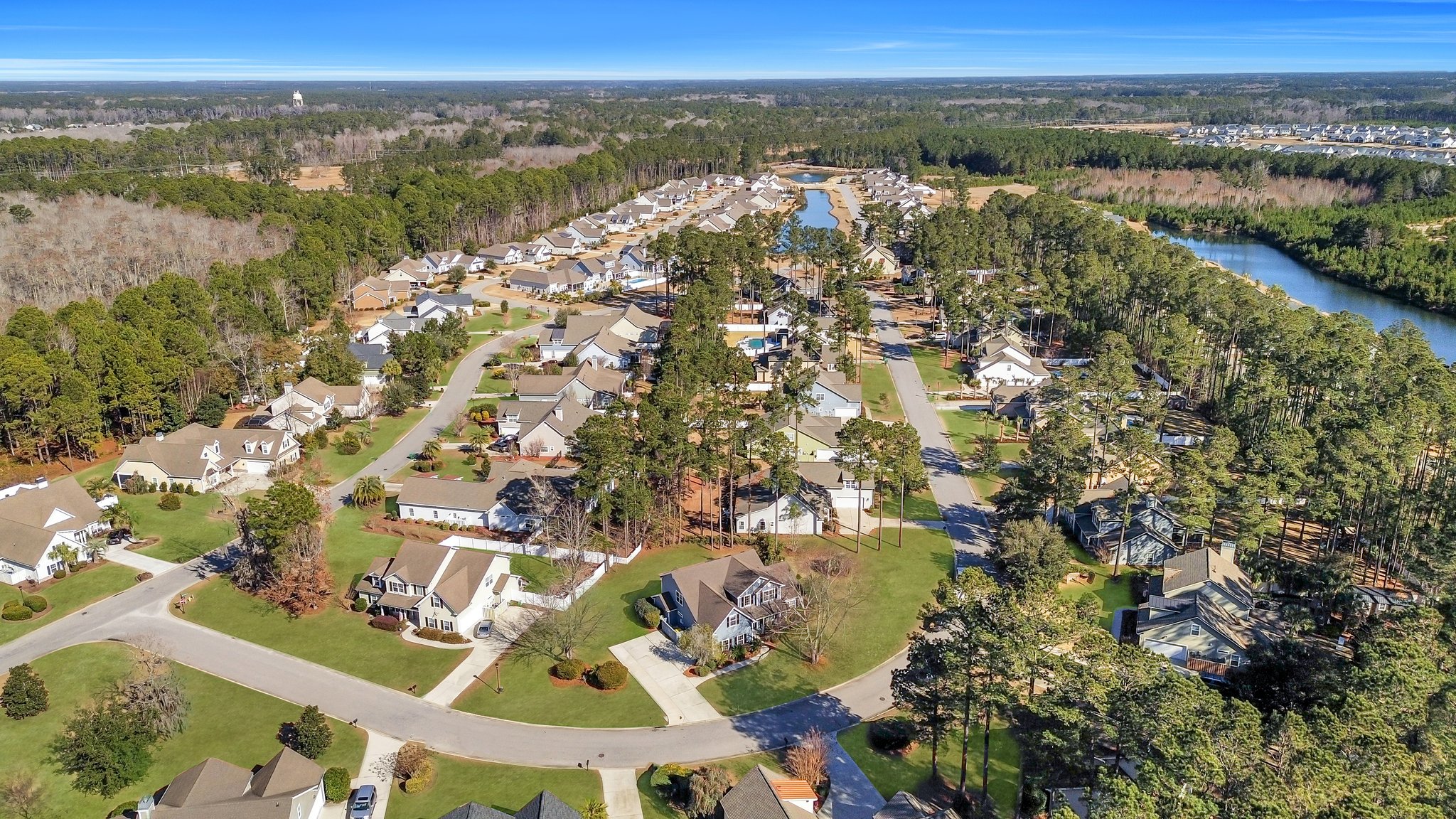 Spacious two-story Bluffton home with five bedrooms, a large yard, and extended driveway in Lawton Station